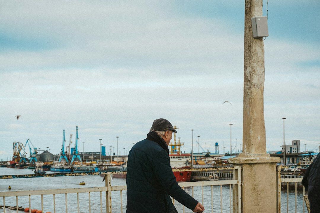 Danish fisherman in a work jacket standing at a harbor